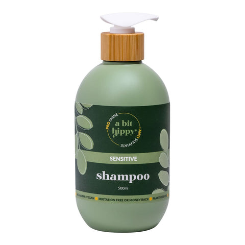 Green 'A Bit Happy Anti-irritation Shampoo' 500ml bottle with a wooden cap on a white background.