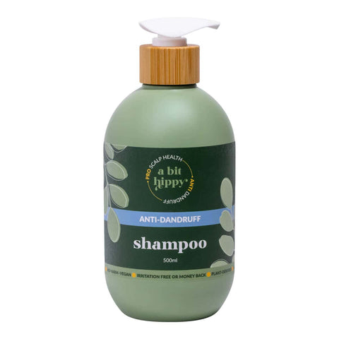 Green shampoo bottle with bamboo pump containing A Bit Hippy Anti-Dandruff Shampoo on a white background.