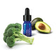 NutraBliss Blue Lotus Night Serum bottle with broccoli styled next to it on a white background.