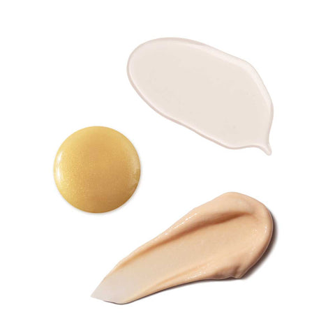 Three swatches of different tones of cream on a white background.