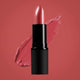 Dusky Sound Pink lipstick swatch on a background of the same colour.
