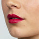 Oriental bay plum lipstick swatch on a person's lips.