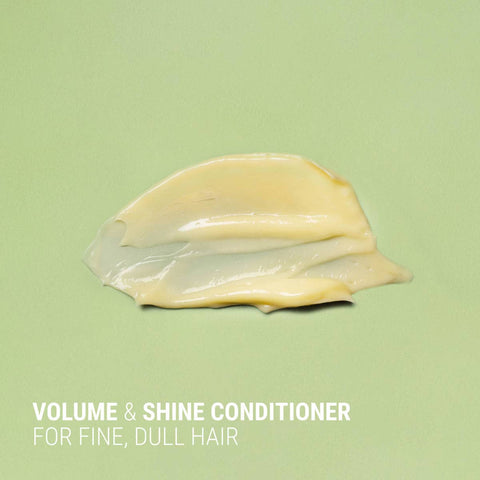 Volume and shine conditioner on a green background with text.