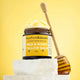 Bottle of 'Milk & Honey Tallow Balm' by barefootskincare on a yellow background