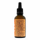 Dropper bottle of turmeric with information about the product & health benefits.