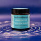 Barefoot Skincare Unscented Tallow Balm jar on a blue and purple gradient background