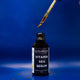 Bottle of Vitamin Sea Serum with a dropper on a blue background
