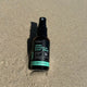 Repel Botanical Body Spray bottle on sand