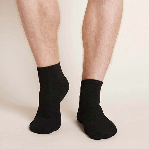 Black unisex ankle socks worn by a man.