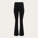 Black flared pants shown on a headless mannequin against a light beige background.