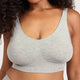 A close-up of a woman wearing a light heather gray ribbed wireless bra with a wide scoop neckline and a small 'BOODY logo on the lower right band.