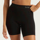 Boody Seamfree Undershorts 6 inch Black lifestyle front view of a person wearing the black shorts with one hand on the hip, styled lifestyle photo