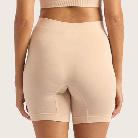 Boody Seamfree Undershorts 6 inch Shell lifestyle back view of a person wearing the pale pink nude shorts, styled lifestyle photo