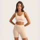 Boody Seamfree Undershorts 6 inch lifestyle shot of a woman in a nude crop top and nude seamless shorts, front view, styled lifestyle photo
