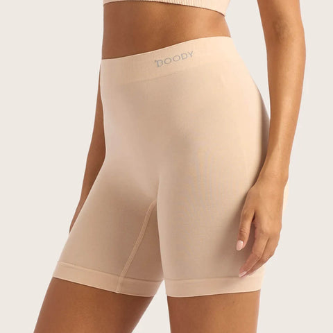 Boody Seamfree Undershorts 6 inch Shell lifestyle side view of a person wearing the pale pink nude shorts, close up of the fit