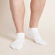 White sport ankle socks worn by a man.