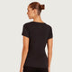 Boody Women's Base Layer V-Neck T-Shirt Black lifestyle back view of a woman with her hair up wearing the black tee, styled lifestyle photo