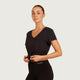 Boody Women's Base Layer V-Neck T-Shirt Black lifestyle shot of a woman in the black v-neck tee with her hands at her waist, front view