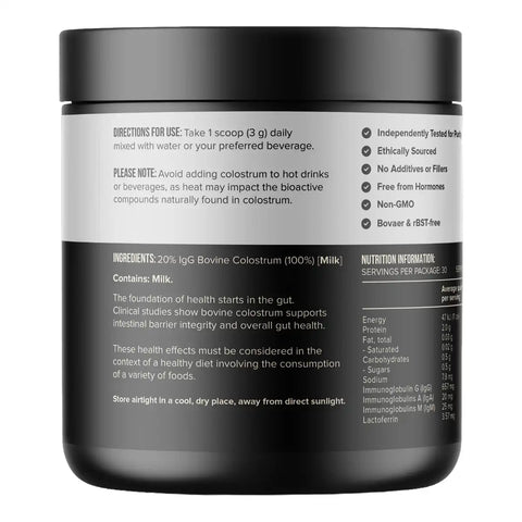 A black plastic tub of colostrum powder with a white and black label showing usage instructions, ingredients, and nutrition facts.