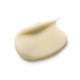 Close-up of a beige cream swatch on a white background