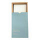 Box of baby laundry detergent sheets with a white sheet inside on a white background.