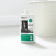 A 500ml bottle of ecostore Floor & All Purpose Cleaner stands on a light gray surface with a white bucket blurred in the background.