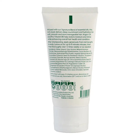 Back view of a white tube of hair care product on a plain white background, showing the back label with text, barcodes, and a green vertical stripe.