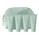 endota Organics skincare gift set featuring four tubes of facial products lined up in front of a matching mint green zippered pouch and box on a white background.