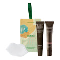 Endota lip duo featuring a cream-coloured box with a green handle, two dark brown lip treatment tubes, and a white silicone lip tool, displayed on a clean white background.