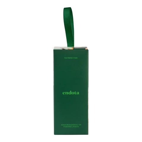 A dark green rectangular product box with a matching green ribbon loop at the top, featuring the brand name 'endota' in light green text on the front, set against a plain white background.