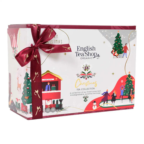 English Tea Shop Organic Christmas Tea Collection gift box, decorated with a dark red ribbon bow and festive illustrations.