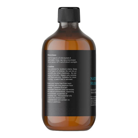 Brown bottle with black cap and label on a white background.