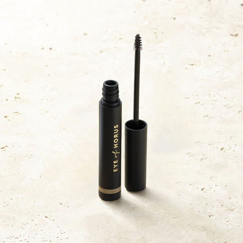 Medium Brown Brow wand on a stone surface.