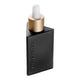 Black and gold dropper bottle with Eye of Horus embossed in the bottle. White background.