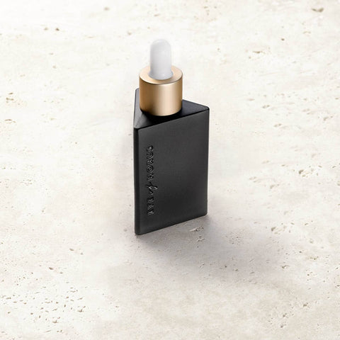 Eye of Horus regenerative serum on a stone surface.