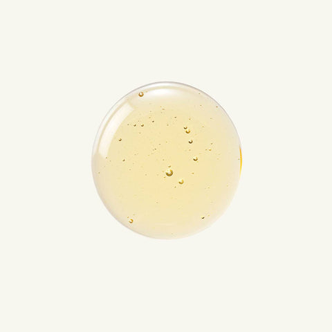 Close up of a drop of eye of horus serum on a white background.