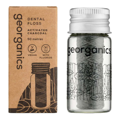 Georganics activated charcoal dental floss packaging with clear container and brown box.