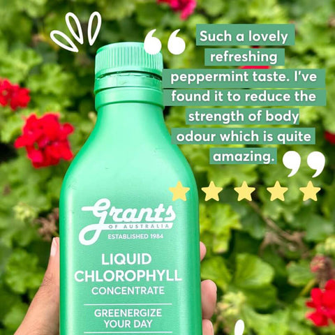 Green bottle of Liquid Chlorophyll held in front of a green leafy background with a testimonial and star rating.