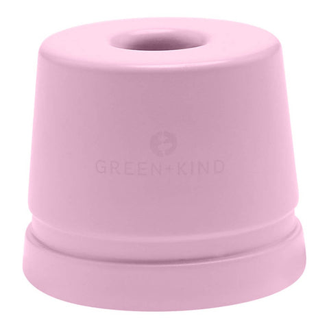 Pink aluminium razor stand with 'Green+Kind' logo on a white background