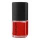 Red nail polish bottle with black cap on a white background