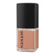 Nail polish bottle with black cap and beige body on a white background.