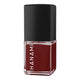 Deep red nail polish bottle with black cap on a white background