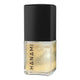 Gold nail polish bottle with black cap on a white background