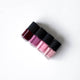 Four lip gloss bottles with 'HANAMI' branding on a white background.
