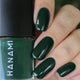 Green nail polish with 'HANAMI' branding on a close-up of nails and bottle.