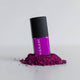 Purple nail polish bottle with black cap on a white background
