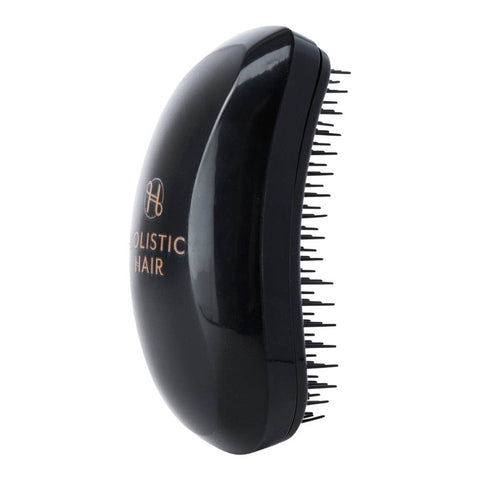 Black hairbrush with 'Holistic Hair' branding on a white background.