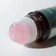 Honest Skincare Organic Castor Oil Rose Quartz Roller 50ml lifestyle close up of the pink rose quartz roller ball on top of the bottle
