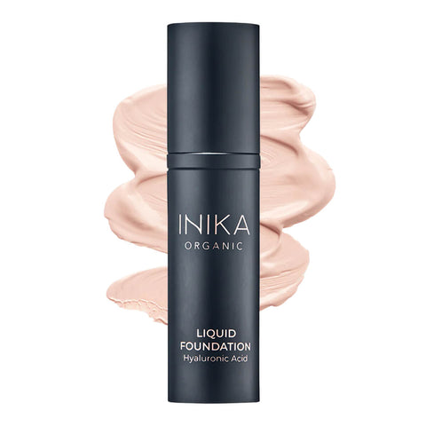 Bottle of INIKA Organic Liquid Foundation with a porcelain-coloured swatch behind it.