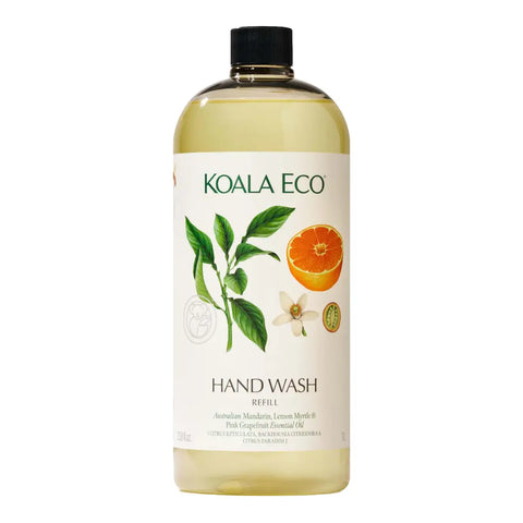 A bottle of Koala Eco Hand Wash refill with a black cap, featuring a white label with green text and illustrations of a lemon myrtle leaf, a sliced orange, and a white flower.